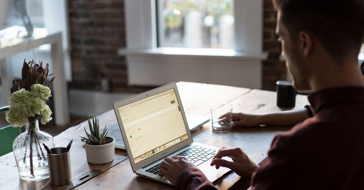 Man on laptop at desk